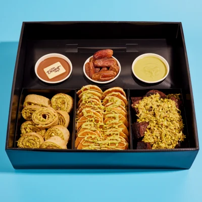 Pistachio sharing box with mini pancakes, crepe rolls, and chocolate bites
