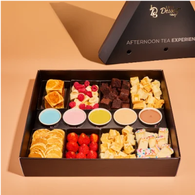 Sharing dessert box with mini pancakes, waffles, brownies, fruit and dipping sauces